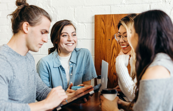 Four friends talking about Budget Techniques